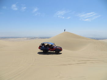 Side view of buggy car at desert