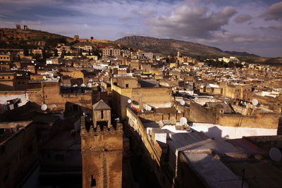 High angle view of buildings in city at night