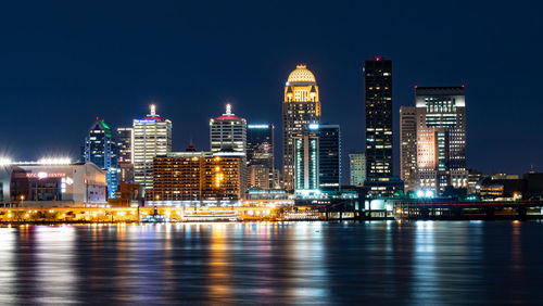 Illuminated buildings in city at night