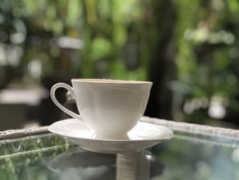 Close-up of coffee cup on table