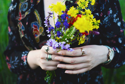 Close-up of woman holding flower bouquet