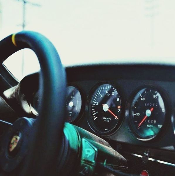 transportation, land vehicle, mode of transport, car, vehicle interior, car interior, close-up, dashboard, part of, travel, reflection, indoors, stationary, technology, motorcycle, street, speedometer, vehicle part, glass - material, cropped