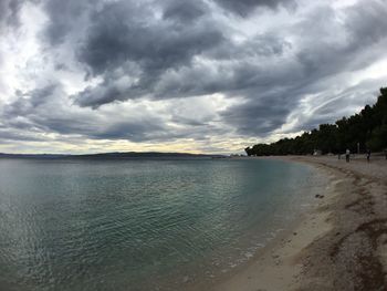 Scenic view of sea against cloudy sky