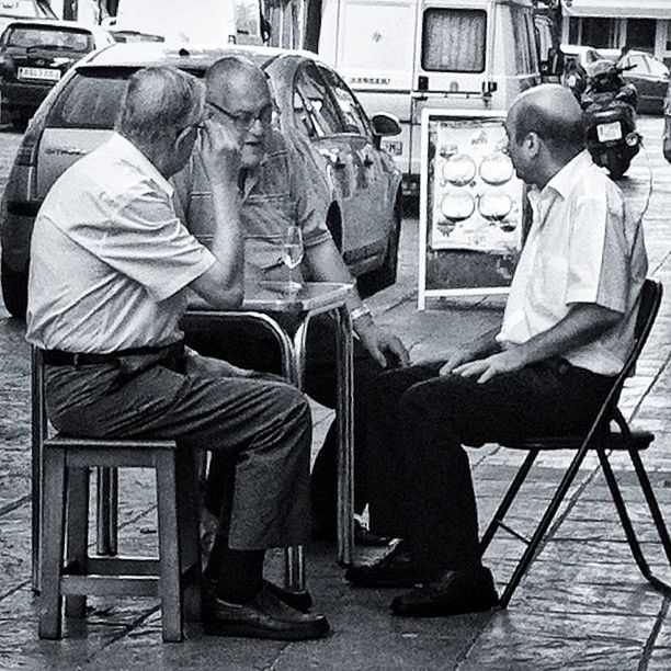 sitting, men, chair, casual clothing, lifestyles, rear view, occupation, full length, working, seat, leisure activity, indoors, side view, relaxation, day, person, mode of transport