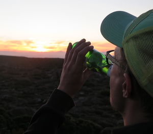 Low section of woman drinking water