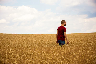 Full length of a man standing in field