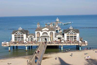 Scenic view of beach by sea against sky