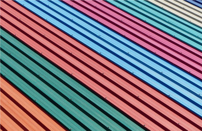 Full frame shot of multi colored metal sheet of roof pattern