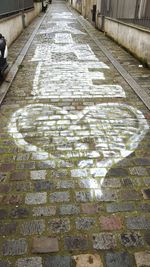 Cobblestone street amidst water