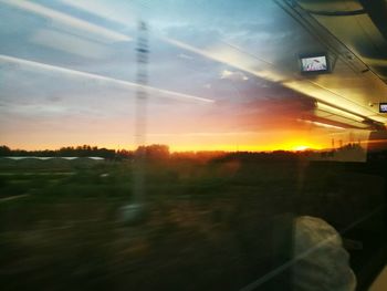 Sunset seen through train window