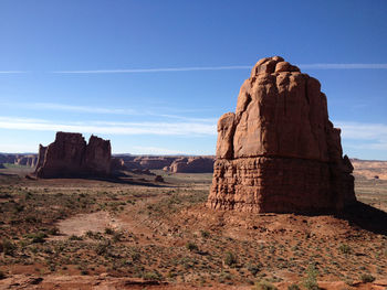 Scenic view of landscape against blue sky