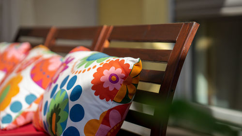 Close-up of multi colored chair on table at home