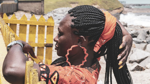 Side view of woman with braided hair