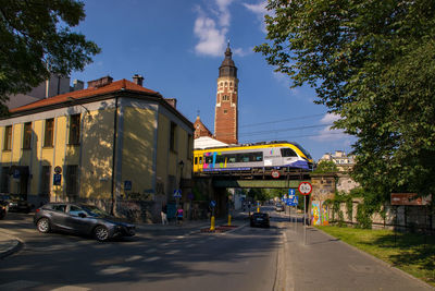 Vehicles on road along buildings