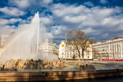 View of the beautiful buildings at vienna city center and the fountain at schwarzenbergplatz