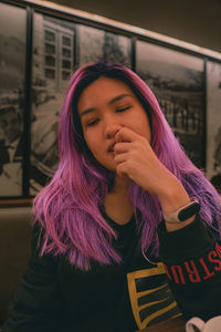 Purple hair asian woman expression