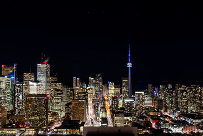 Illuminated buildings in city at night