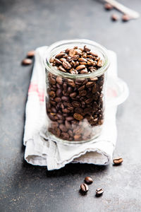 Close-up of roasted coffee beans on table