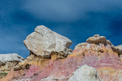 Landscape of white, pink and yellow rock formations at interpretive paint mines in colorado