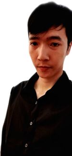 Close-up portrait of young man against white background