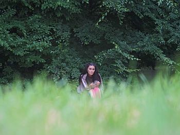 Woman sitting in a forest