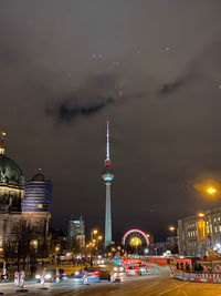 Illuminated buildings in city at night