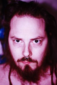 Close-up portrait of serious young man