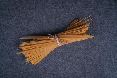 High angle view of bread on leaf against black background