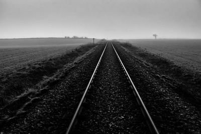 Railroad track against clear sky