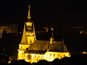 View of church lit up at night