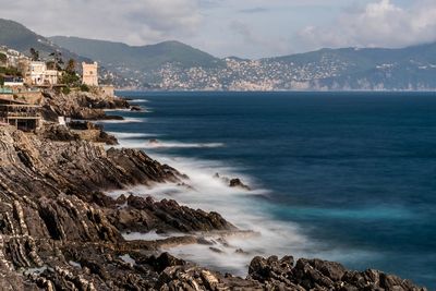 Scenic view of sea and buildings against sky