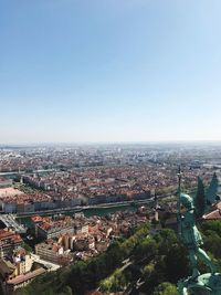 Aerial view of cityscape against clear sky