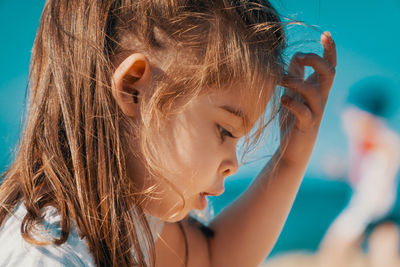 Close-up of girl at beach