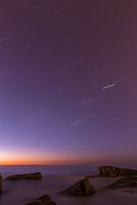 Scenic view of sea against sky at night