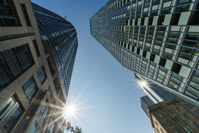 Low angle view of modern buildings against clear sky