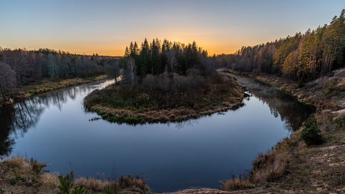 Scenic view of lake against sky during sunset