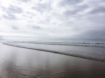 Scenic view of calm sea against sky