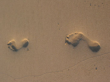Full frame shot of footprints on sand