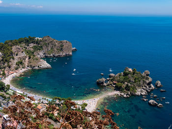 High angle view of sea against blue sky