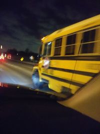 Blurred motion of car on road at night