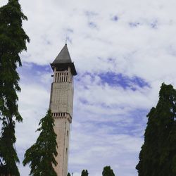 Low angle view of bell tower against sky