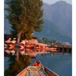 Close-up of boat in lake against sky