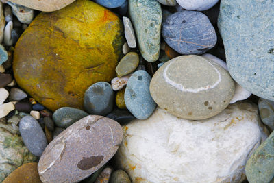 High angle view of stones on pebbles