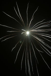 Low angle view of illuminated sky at night