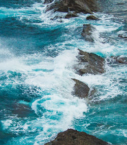 Sea waves splashing on rocks