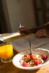 Close-up of breakfast served on wooden table