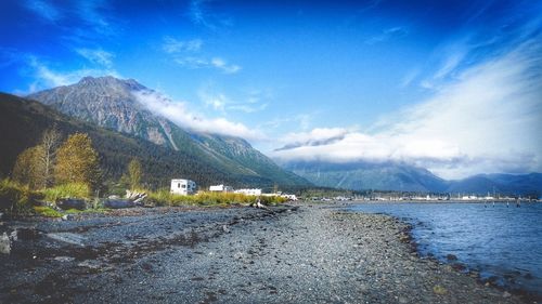 Scenic view of beach against blue sky