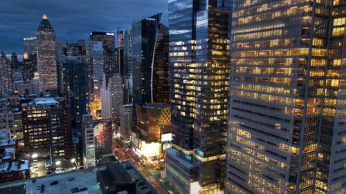 Illuminated buildings in city at night