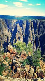 Scenic view of rocky mountains against sky