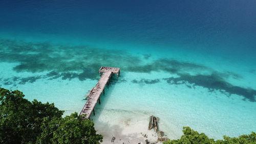 High angle view of sea against blue sky